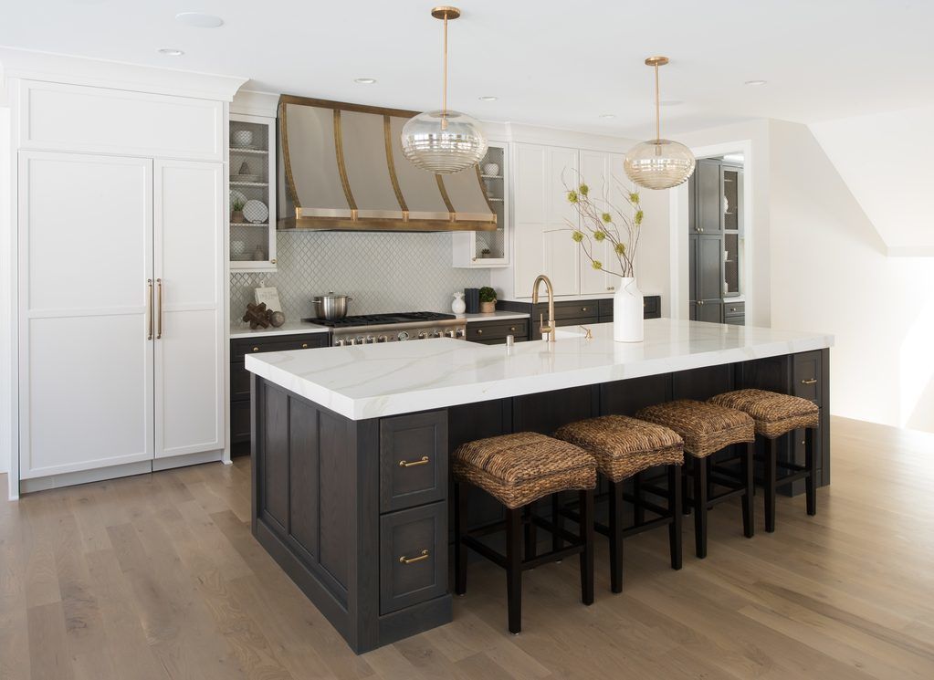 Kitchen island design featuring cabinet storage and seating. 