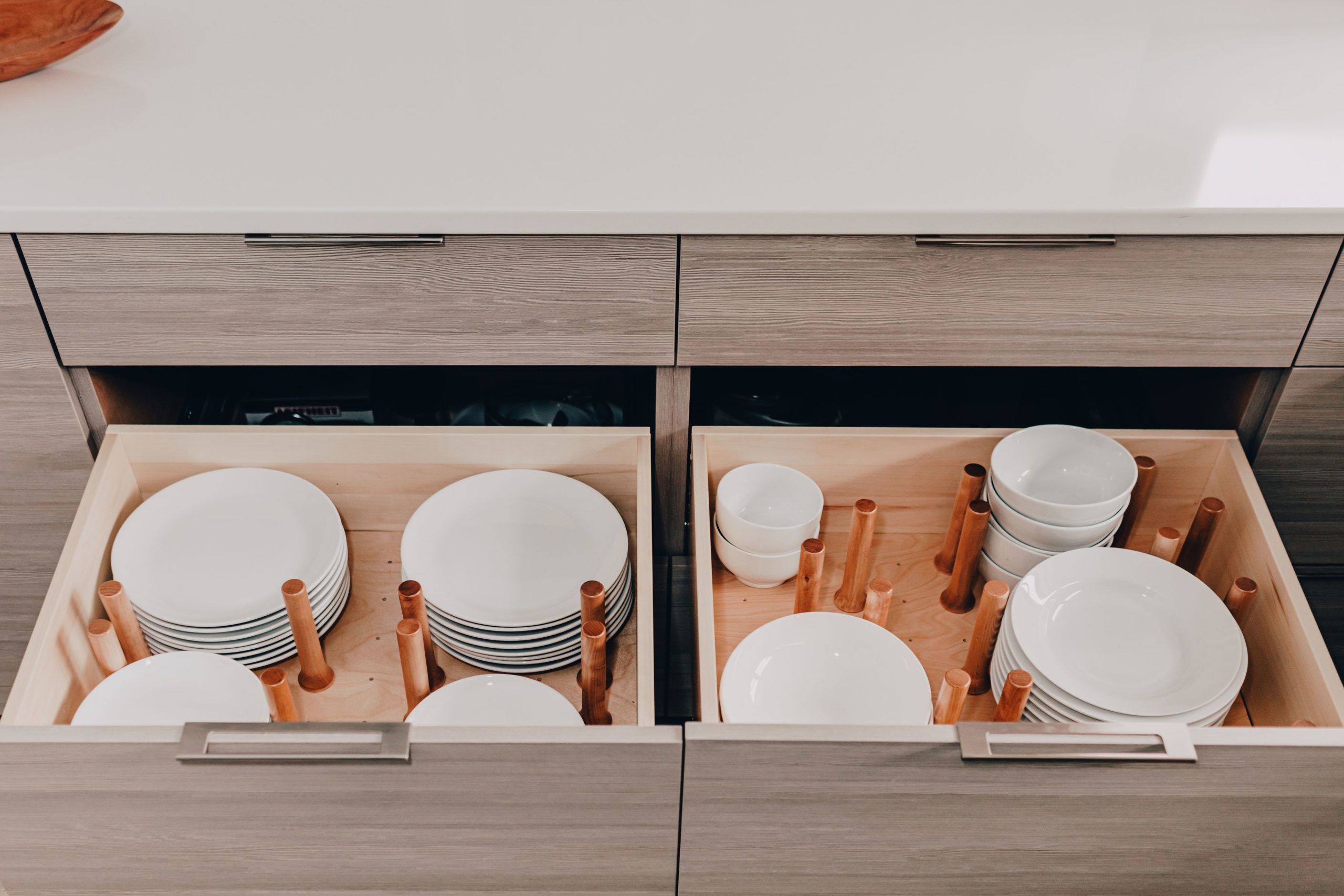 Modern Kitchen Cabinetry Design with Dish Drawer Storage