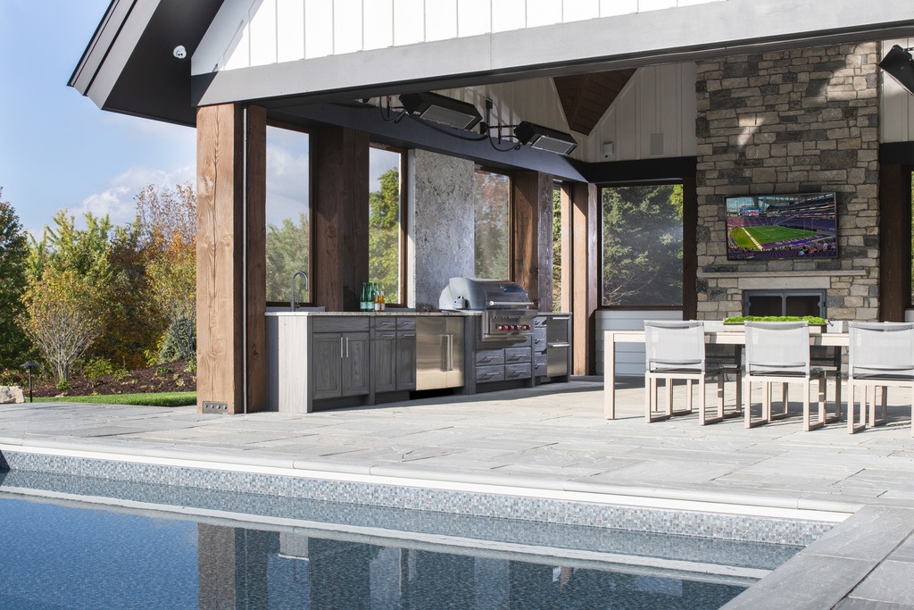 Outdoor Kitchen and Living Space by Studio M Kitchen & Bath