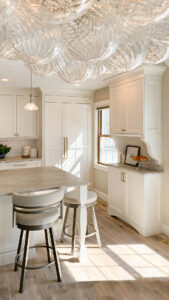 Traditional white kitchen with custom island and buffet