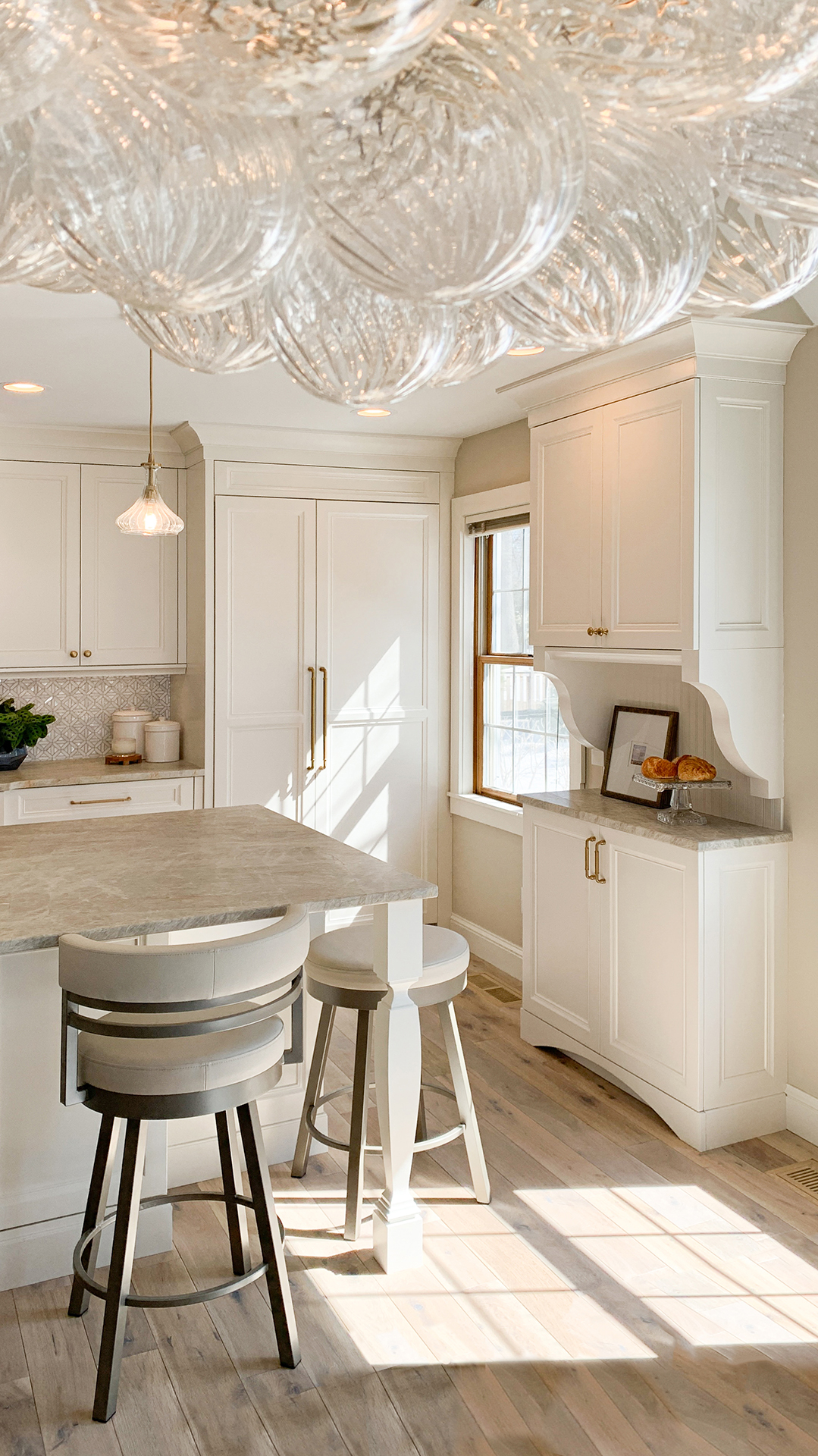 Studio M Tonka Bay Beach House Kitchen Traditional white kitchen with custom island and buffet